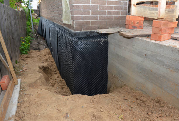 Happy homeowners after waterproofing job in Glenolden